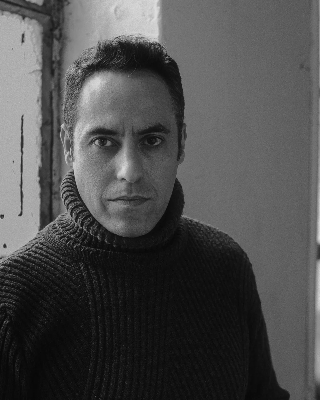 Tom Salta by a studio window